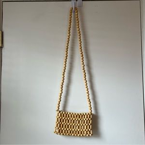 Wood beaded mini cross body bag